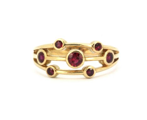 A 9ct yellow gold Boodles style ruby set ring, (Q).