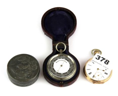 A cased pocket barometer, a gold plated pocket watch and a hammered pewter box.