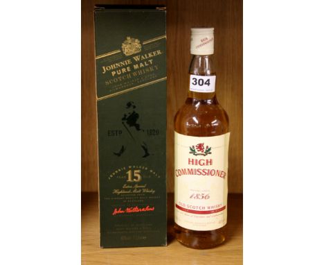 A boxed bottle of Johnny Walker green label scotch whiskey and a bottle of High Commissioner whiskey.