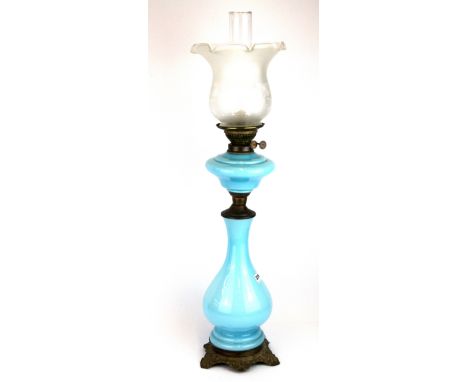 A 19th century opaline glass oil lamp with etched glass shade, H. 81cm.
