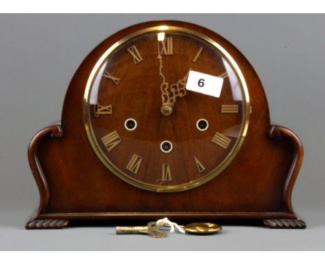 An attractive wooden chiming mantle clock, H. 23cm.