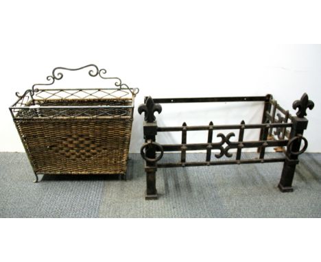 A metal and wicker magazine rack and a log grate.