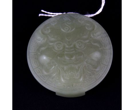 A Chinese carved nephrite jade buckle, Dia. 6cm.