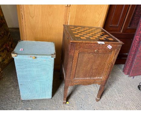 Lloyd loom style linen basket along with commode cupboard with chessboard top