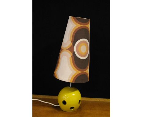 RETRO LAMP - a vintage yellow ceramic lamp base featuring circular holes and a tall retro print shade.
