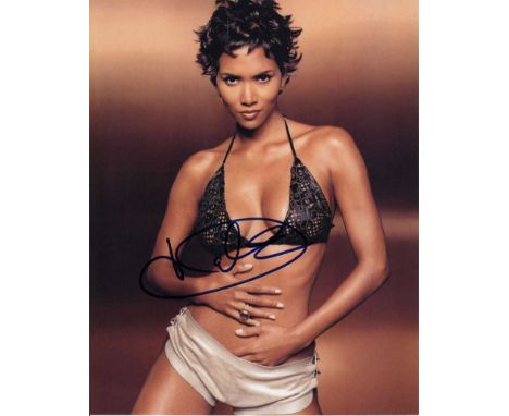 Halle Berry signed 10 x 8 colour photo. Scorching hot sexy portrait of the actress.   Good condition.  All items come with a 