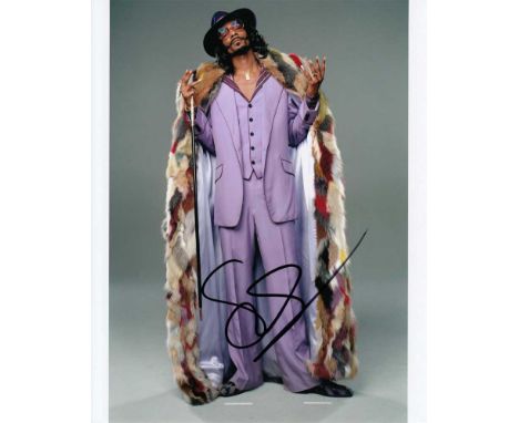 Snoop Dogg signed 10 x 8 colour photo. Brilliant portrait photo of the rapper.   Good condition.  All items come with a Certi