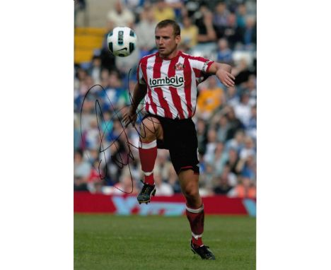 Lee Cattermole signed 10 x 8 colour photo. Football action photo signed by Lee Cattermole seen here playing for Sunderland.  