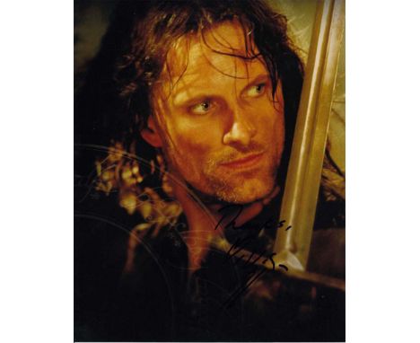 Viggo Mortensen signed 10 x 8 colour photo. Character photo of him from Lord of the Rings as Aragorn.   Good condition.  All 