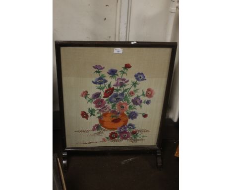 A FRAMED AND GLAZED TAPESTRY FIRESCREEN Wear to frame surface at bottom and to feet.  back board loose, fabric generally good