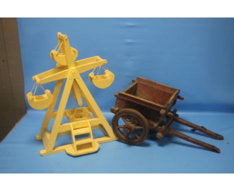 A WOODEN MODEL OF A FAIRGROUND RIDE TOGETHER WITH A WOODEN CART  (2)