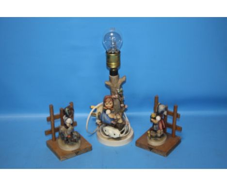 A GOEBEL LAMP TOGETHER WITH A PAIR OF GOEBEL FIGURES (3)