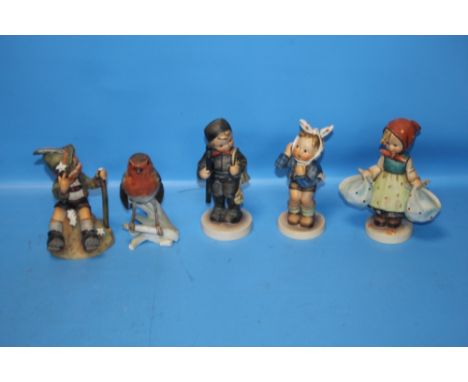 FOUR GOEBEL FIGURES TOGETHER WITH A GOEBEL ROBIN (5) Condition Reports: The boy figure has the top of the staff broken off an