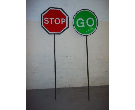 A PAIR OF VINTAGE STOP/GO ROAD WORK LOLLIPOP SIGNS