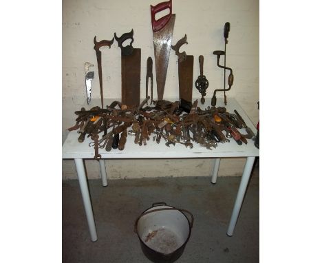 A SELECTION OF VINTAGE TOOLS INCLUDING SAWS, SPANNERS, BRADAWLS, AND SCREWDRIVERS