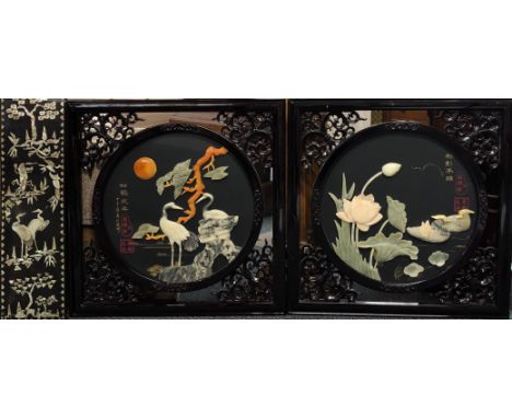 Two Chinese lacquered panels overlaid with soapstone with a further mother of pearl inlaid panel, size 58 x 58cm.