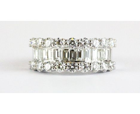 An 18ct white gold (stamped 750) ring set with brilliant and baguette cut diamonds, approx. 2.53ct, (O.5).