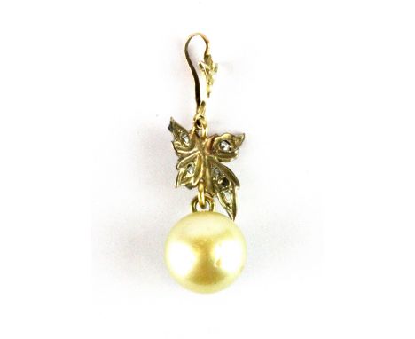 An antique yellow metal (tested 9ct gold) pendant set with a cream pearl and diamonds, L. 4.2cm.