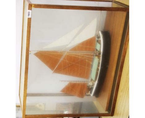 A cased handmade wooden model of a sailing barge, case 57 x 67 x 27cm. Prov. Bertie Bardell estate.