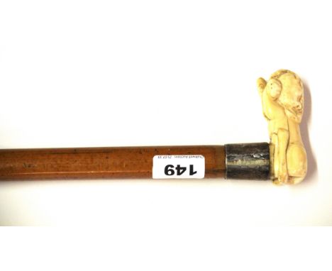 A 19th Century ivory handled walking stick, handle W. 9cm stick L. 88cm.