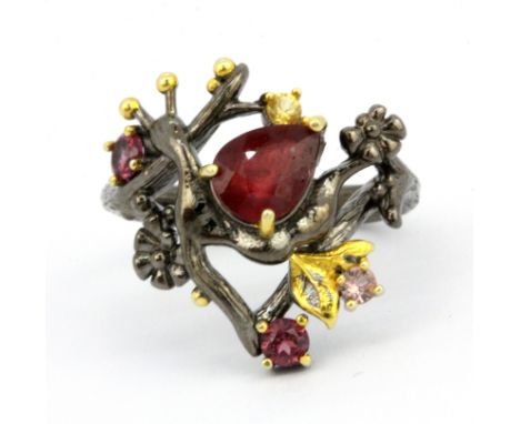 A 925 silver gilt ring snail shaped ring set with a pear cut ruby, tourmalines and other semi-precious stones, (P).