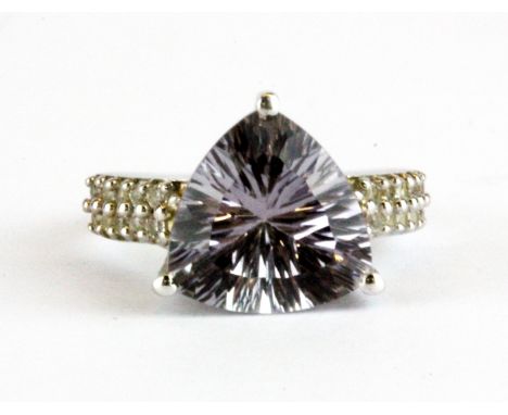 A 925 silver ring set with a trillion concave cut fluorite and white stone set shoulders, (L).