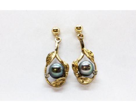 A pair of 9ct yellow gold black pearl and diamond set drop earrings, L. 2.6cm.