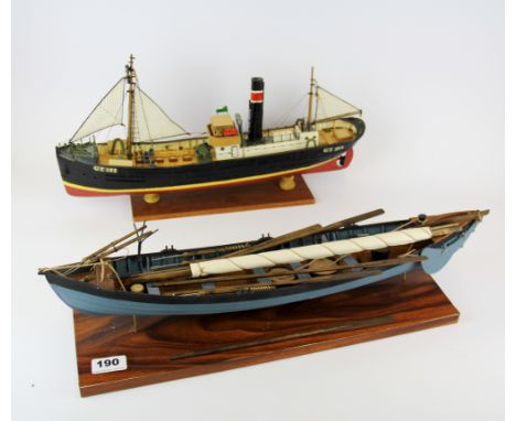 A handmade wooden model of a rowing boat and a further model of a steam ship, L. 55cm L. 47cm. Prov. Bertie Bardell estate.