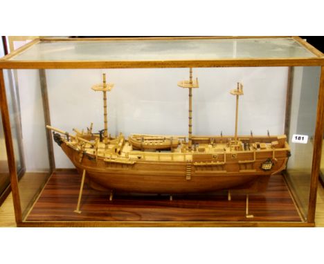 A glass cased handmade wooden model of a galleon with cut away on one side, case 81 x 36 x 47cm. Prov. Bertie Bardell estate.