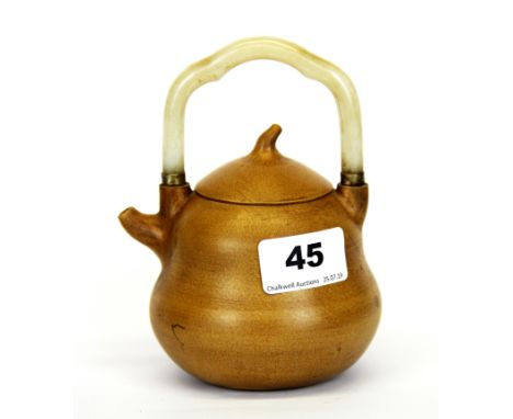 A pale Chinese Yixing terracotta teapot with white jade handle, H. 14cm.