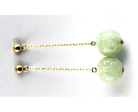 A pair of 14ct yellow gold (stamped 14k) carved jade set drop earrings, L. 4cm, (one butterfly missing).