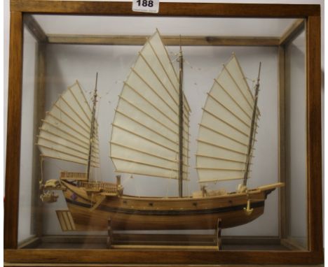A glass cased handmade wooden model of a Chinese junk, case 45 x 22 x 37cm. Prov. Bertie Bardell estate.