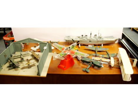 A handmade wooden model of an aircraft hanger with a quntity of kit model aircraft and an aircraft carrier. Prov. Bertie Bard