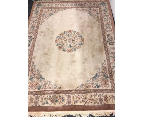 A large Chinese cream ground washed wool carpet, 390 x 280cm.