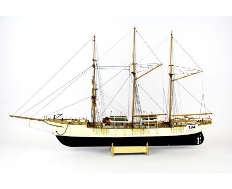 A handmade wooden model of a three masted sailing ship, L. 64cm. Prov. Bertie Bardell estate.