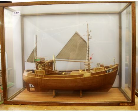 A glass cased wooden model of a fishing trawler, case 66 x 51 x 27cm. Prov. Bertie Bardell estate.