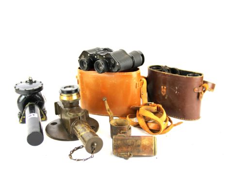 A pair of military issue binoculars, a further pair of binoculars, a 1943 tele-level and a hand held optical compass.