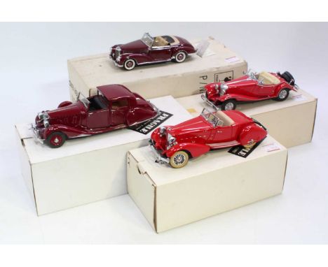 Four various boxed Franklin Mint and Danbury Mint 1/24 scale diecast vehicles to include a 1957 Mercedes Benz 300SC, a Merced