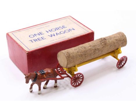 A Charbens series lead hollow cast model of a horse drawn tree wagon, comprising of brown horse with yellow trailer and log l