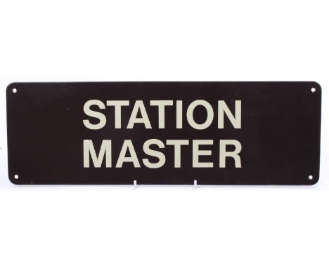 A BR western region reproduction enamel sign "Station Master" in brown. measures 18 inches by 6, 4 fixing holes. overall good
