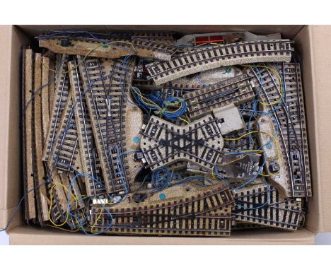 Box containing a large collection of Marklin 3-rail stud collection track. A very wide and varied assortment. (VG-E)