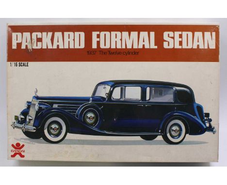 A Bandai No. 8069 1/16 scale plastic kit for a 1937 12-cylinder Packard formal sedan, model has been partly removed from spru