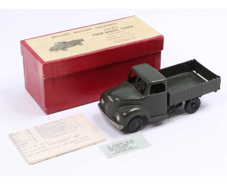 A Britains No. 1334 four wheel army truck comprising of military drab green body with matching hubs and driver figure complet