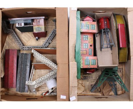 Two large trays containing 0-gauge tinplate accessories: Bing water tower (E); German made British outline station; two Brimt