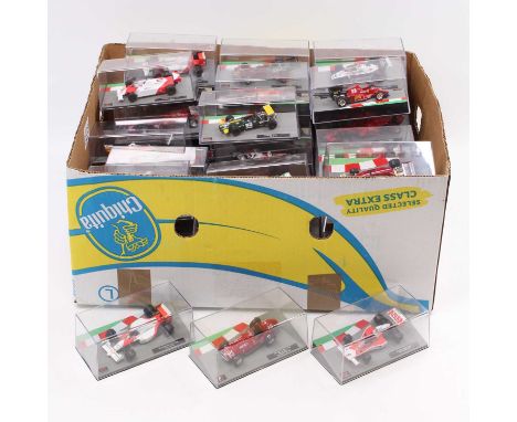 A collection of 1/43 and 1/64 scale Minichamps and De Agostini Formula One racing diecasts to include an Indy 500 Alberto Esc