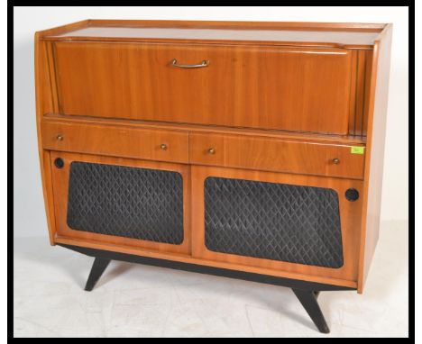 A stunning mid 20th Century walnut cased cocktail cabinet, full length full front cupboard glazed to the inside, mirror back 