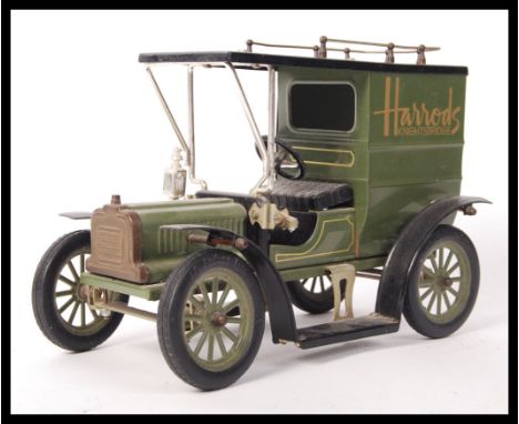 A Limited Edition Of Ipswich England scale diecast model car of a Ford Model T in green with the Harrods Knightsbridge logo t