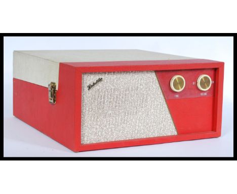 A vintage retro 20th century Fidelity portable picnic record player having a BSR deck set to a two tone red and white vinyl c