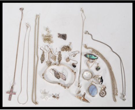 A collection of vintage 20th century silver jewellery to include a 16 inch long silver anchor link chain, a curb heavy 16 inc