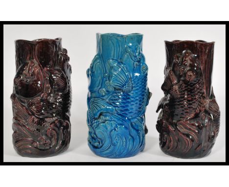 A group of three 20th century ceramic vases in the form of Koy carp fish fish jumping from water with Japanese style waves tw